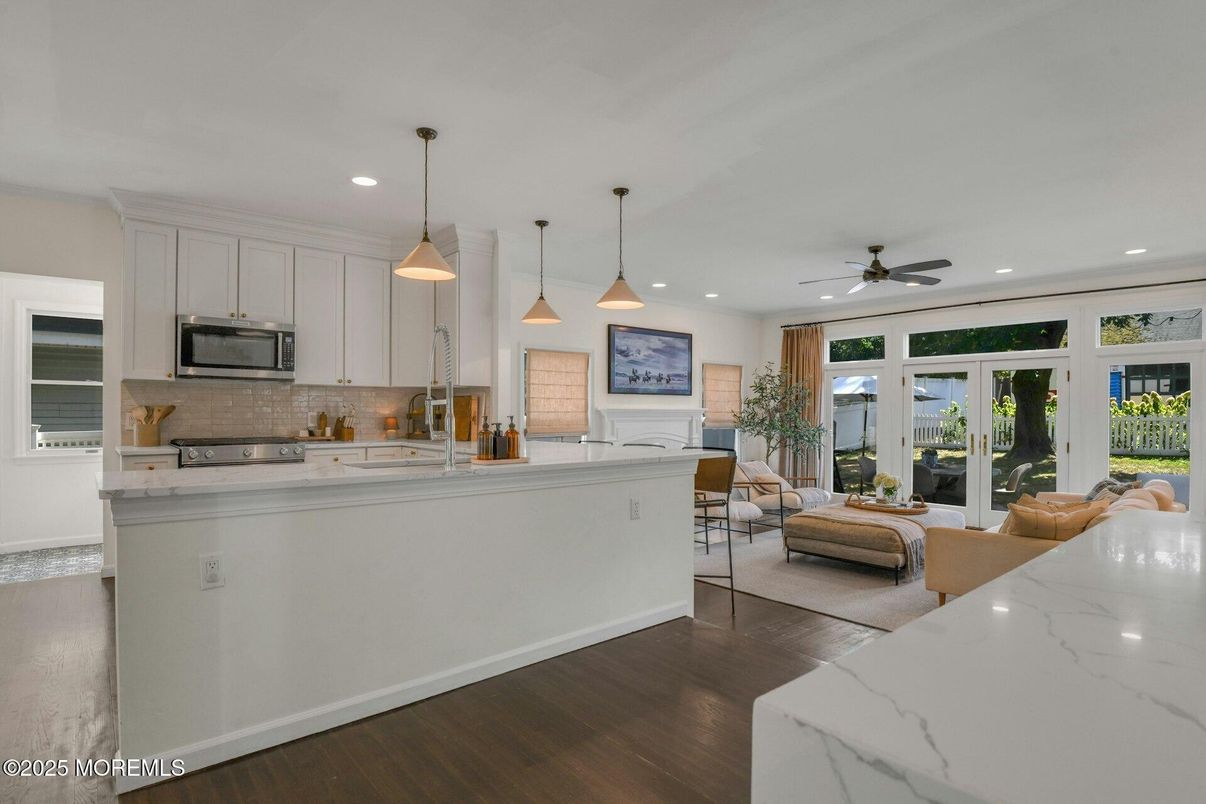 Dining room, Interior, Kitchen, Living room, Pendant Lights, Recessed Lighting, Stainless Steel Appliances, Wood Texture Flooring