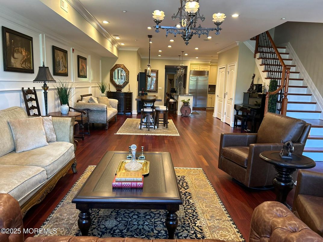 Chandelier, Dining room, Interior, Kitchen, Living room, Pendant Lights, Recessed Lighting, Stainless Steel Appliances, Wood Texture Flooring