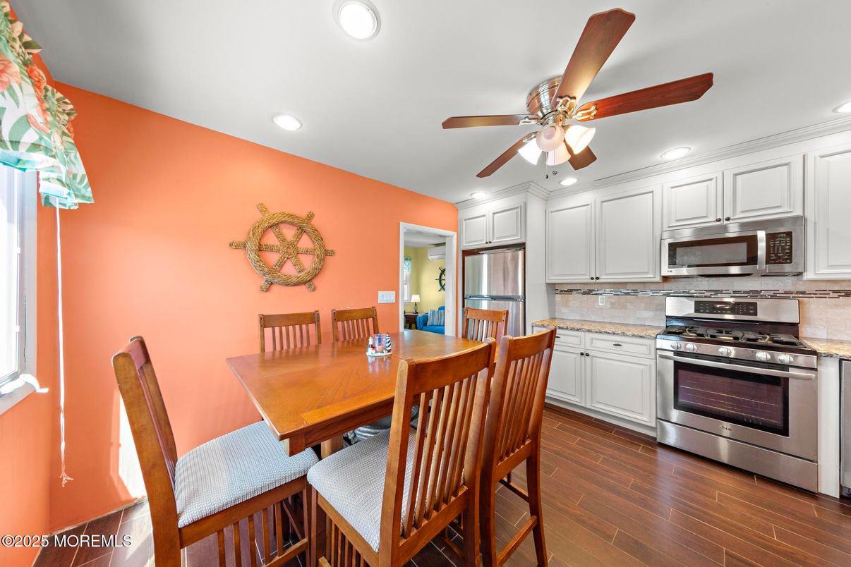 Dining room, Interior, Kitchen, Recessed Lighting, Stainless Steel Appliances, Wood Texture Flooring