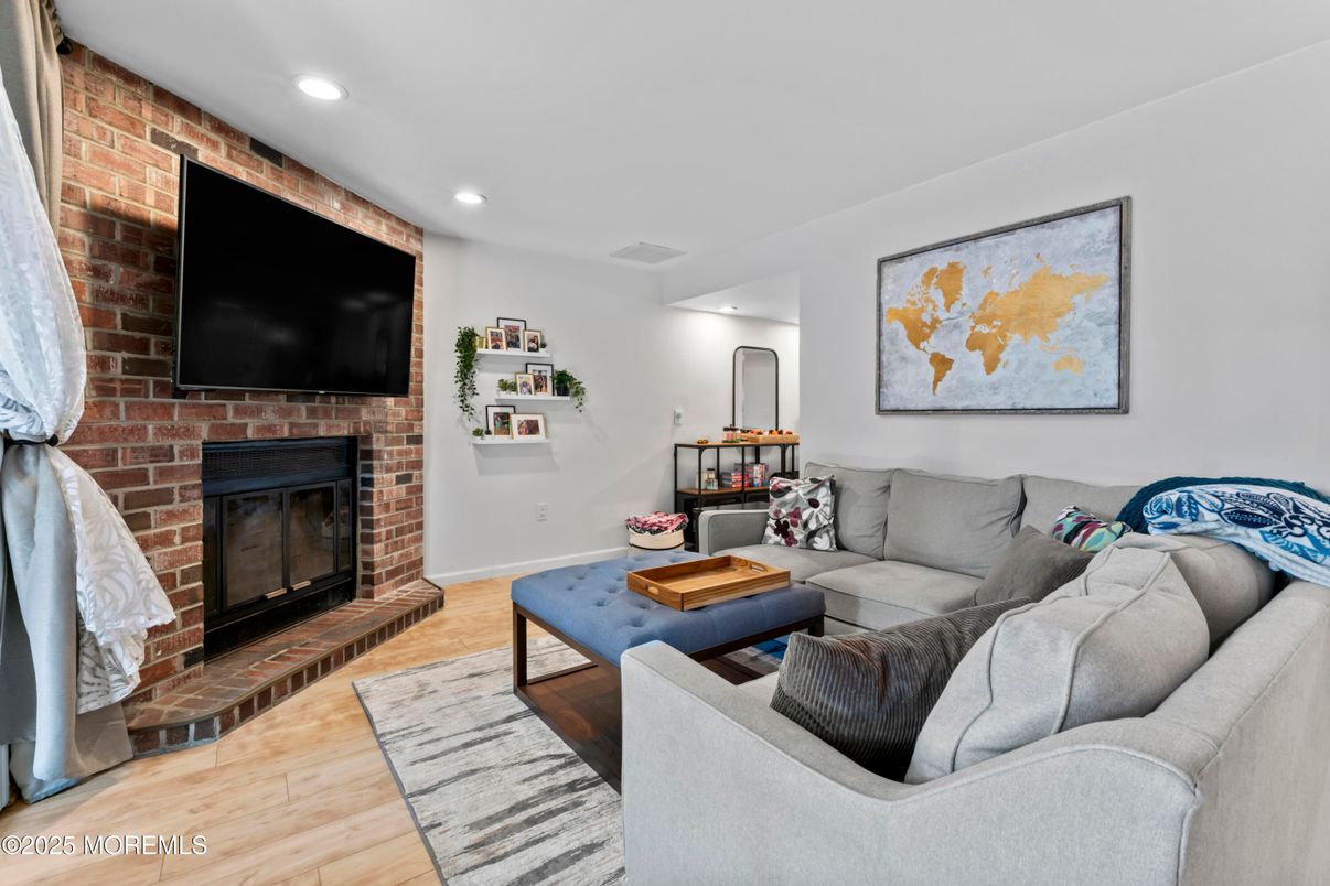 Fireplace, Interior, Living room, Recessed Lighting, Stone Walls, Wood Texture Flooring
