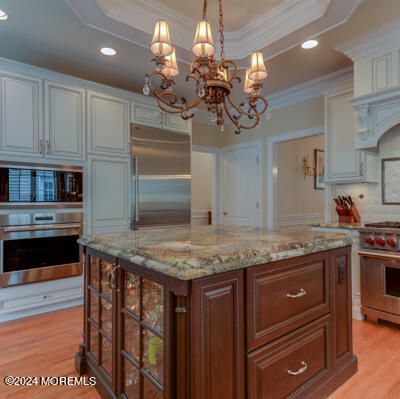 Chandelier, Interior, Kitchen, Recessed Lighting, Stainless Steel Appliances, Wood Texture Flooring