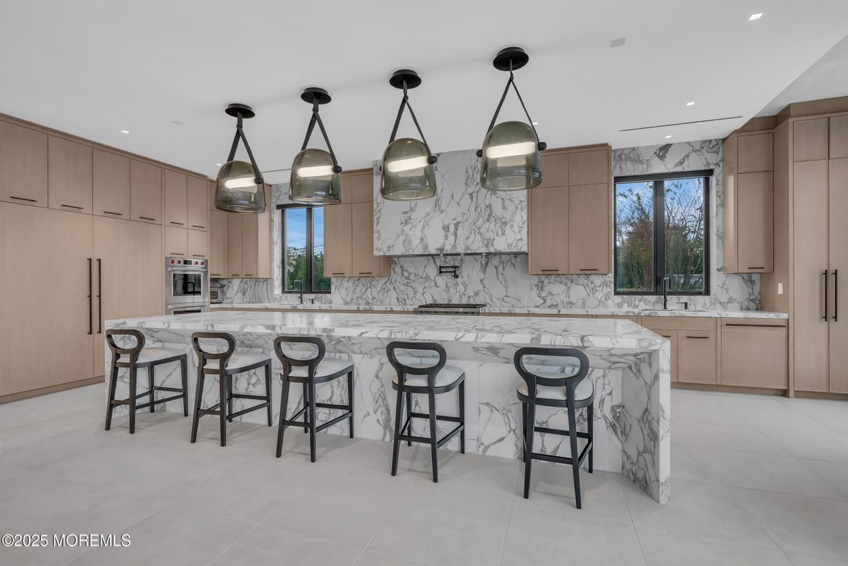Interior, Kitchen, Marble Walls, Pendant Lights, Recessed Lighting, Stainless Steel Appliances