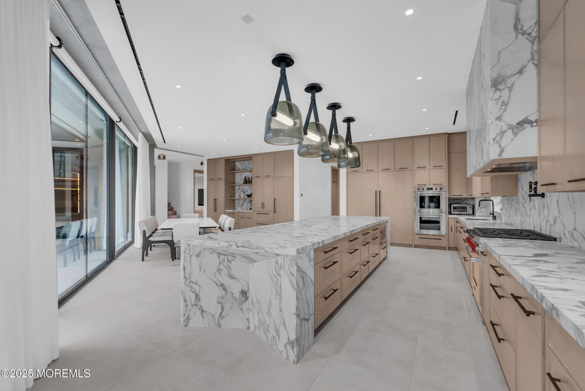 Dining room, Interior, Kitchen, Marble Walls, Pendant Lights, Recessed Lighting, Stainless Steel Appliances