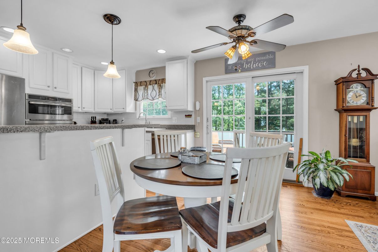 Dining room, Interior, Kitchen, Pendant Lights, Recessed Lighting, Stainless Steel Appliances, Wood Texture Flooring