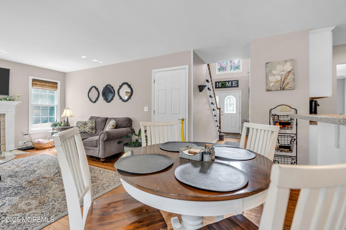 Dining room, Fireplace, Interior, Living room, Recessed Lighting, Wood Texture Flooring