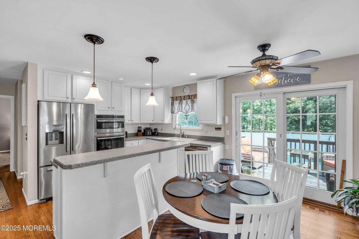 Dining room, Interior, Kitchen, Pendant Lights, Recessed Lighting, Stainless Steel Appliances, Wood Texture Flooring