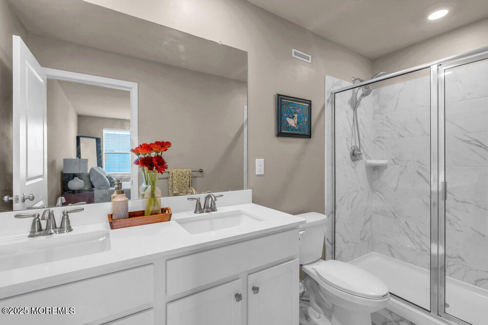 Bathroom, Dual Sink Vanities, Glass Shower, Interior, Marble Walls, Recessed Lighting