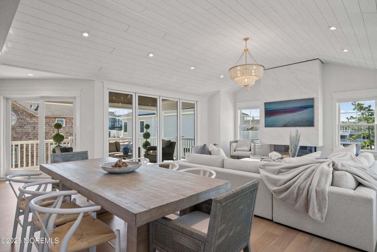 Chandelier, Dining room, Fireplace, Interior, Living room, Recessed Lighting, Wood Texture Flooring