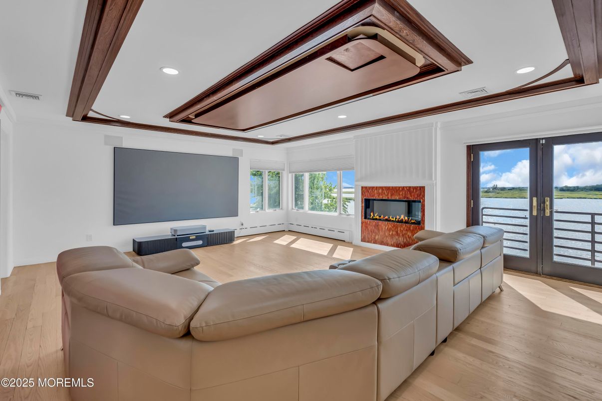 Fireplace, Interior, Living room, Recessed Lighting, Water, Wood Texture Flooring