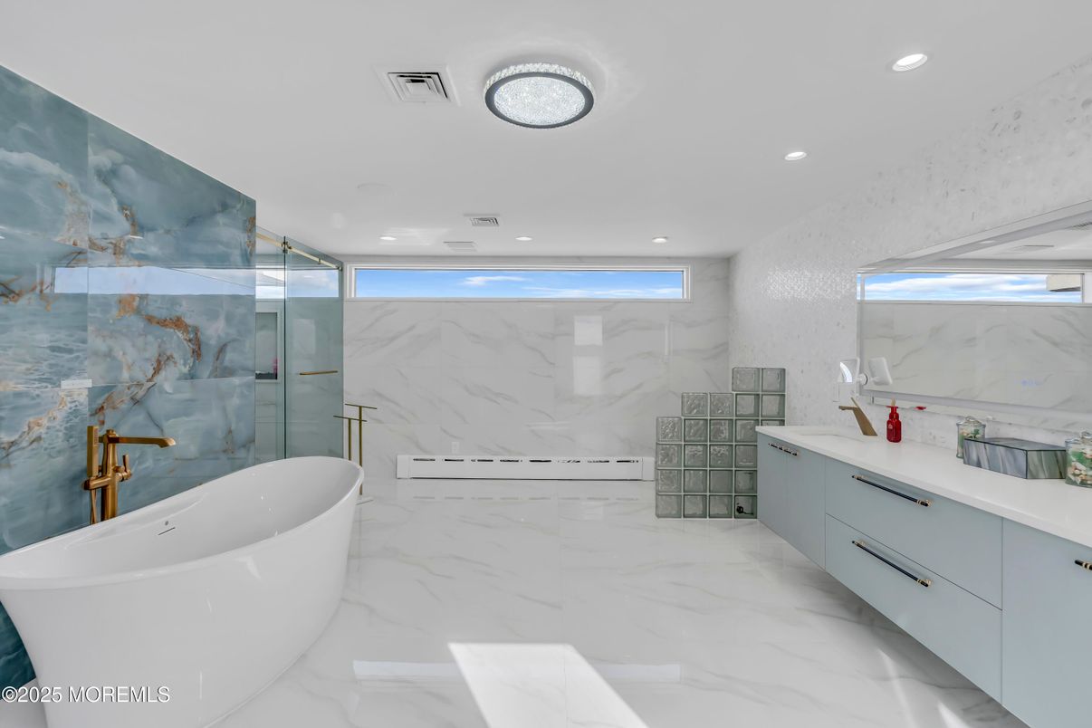 Bathroom, Dual Sink Vanities, Free Standing Baths, Glass Shower, Interior, Marble, Marble Walls, Recessed Lighting