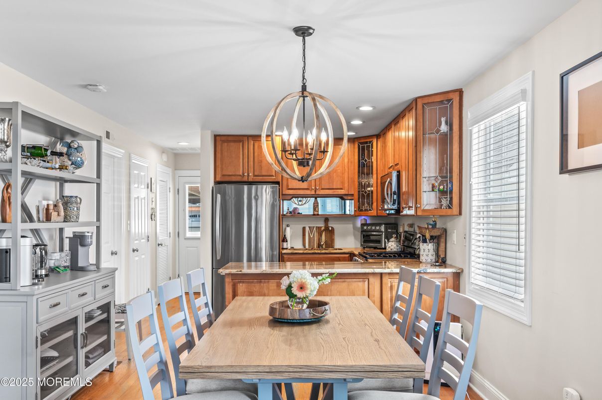 Chandelier, Dining room, Interior, Kitchen, Recessed Lighting, Stainless Steel Appliances, Wood Texture Flooring