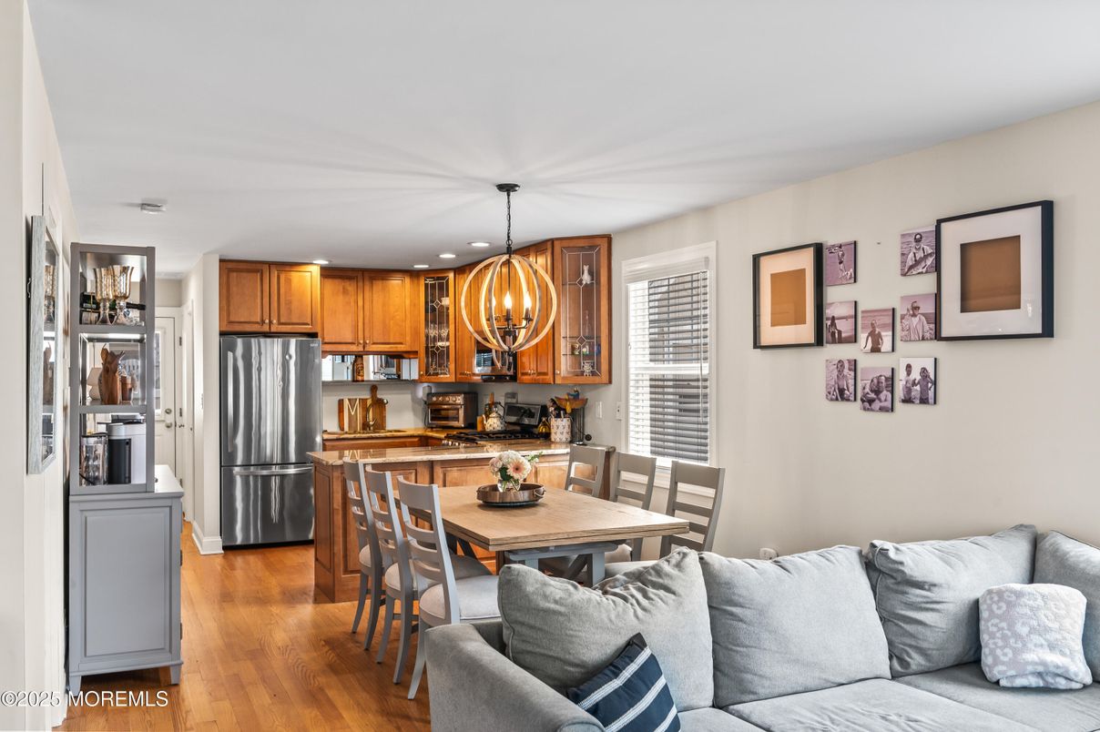 Dining room, Interior, Kitchen, Living room, Pendant Lights, Recessed Lighting, Stainless Steel Appliances, Wood Texture Flooring