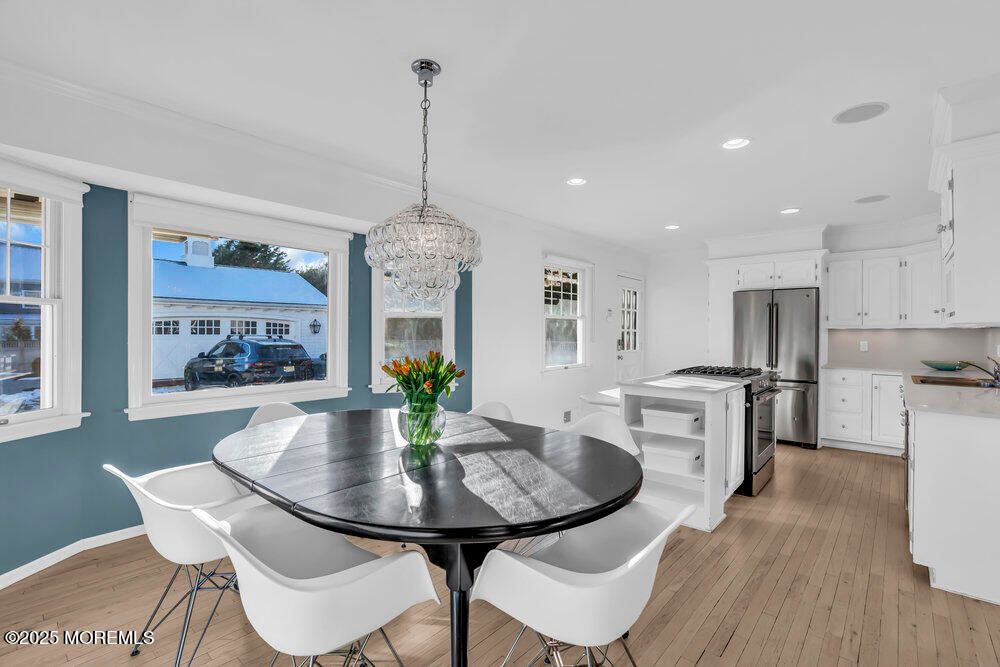 Chandelier, Dining room, Interior, Kitchen, Pendant Lights, Recessed Lighting, Stainless Steel Appliances, Wood Texture Flooring