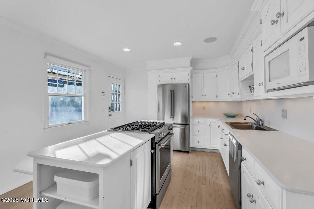 Interior, Kitchen, Recessed Lighting, Stainless Steel Appliances, Wood Texture Flooring