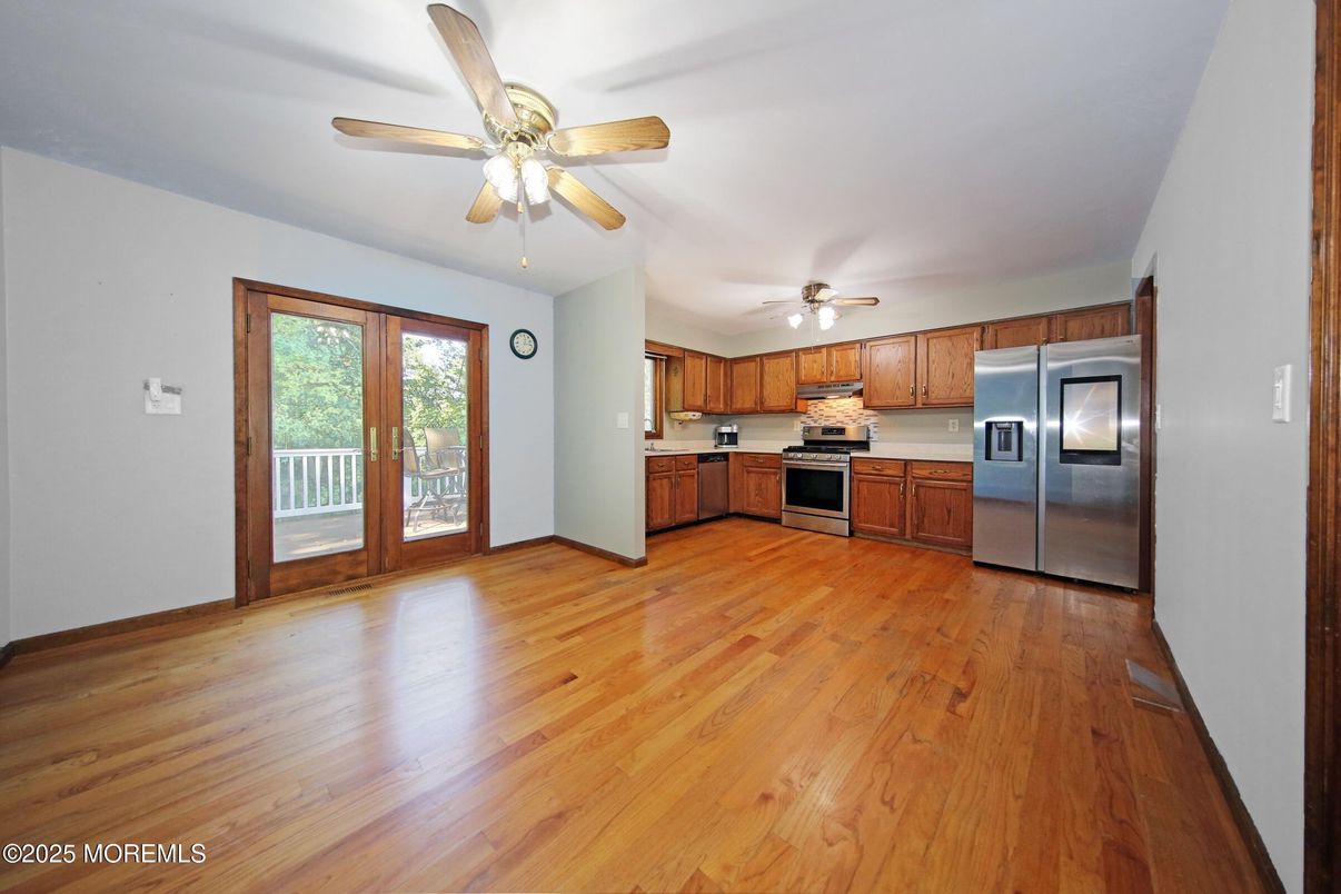 Empty room, Interior, Kitchen, Stainless Steel Appliances, Wood Texture Flooring