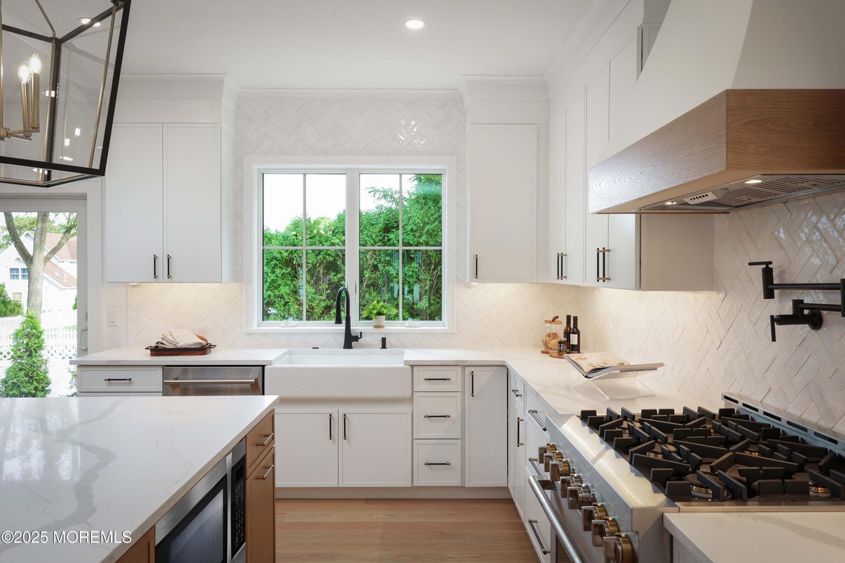 Interior, Kitchen, Marble Walls, Recessed Lighting, Stainless Steel Appliances, Wood Texture Flooring