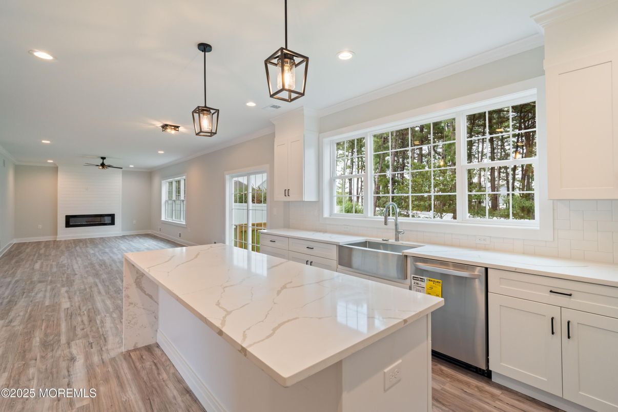 Fireplace, Interior, Kitchen, Pendant Lights, Recessed Lighting, Stainless Steel Appliances, Wood Texture Flooring