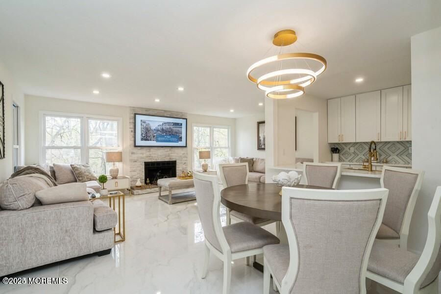 Dining room, Fireplace, Interior, Living room, Marble, Pendant Lights, Recessed Lighting