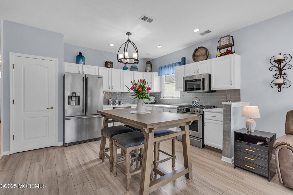 Chandelier, Interior, Kitchen, Pendant Lights, Recessed Lighting, Stainless Steel Appliances, Wood Texture Flooring