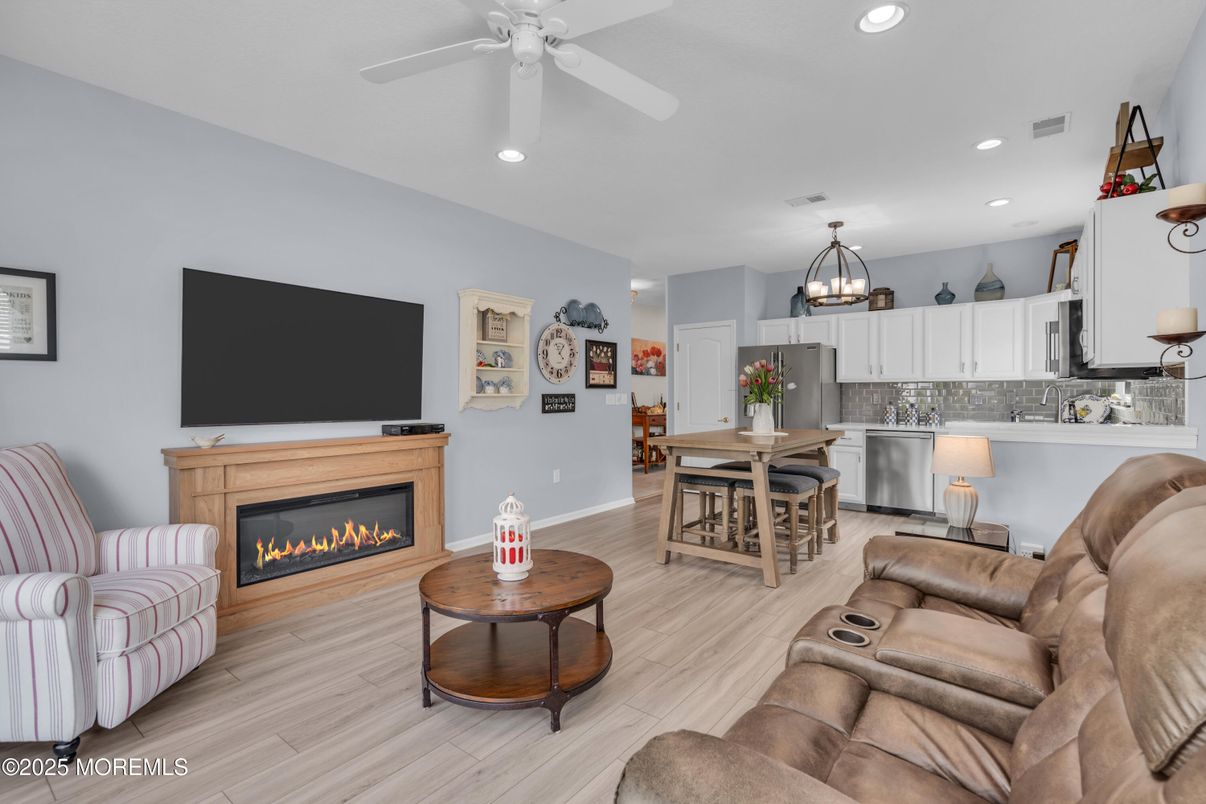 Home Theatre Room, Dining room, Fireplace, Interior, Kitchen, Living room, Recessed Lighting, Stainless Steel Appliances, Wood Texture Flooring