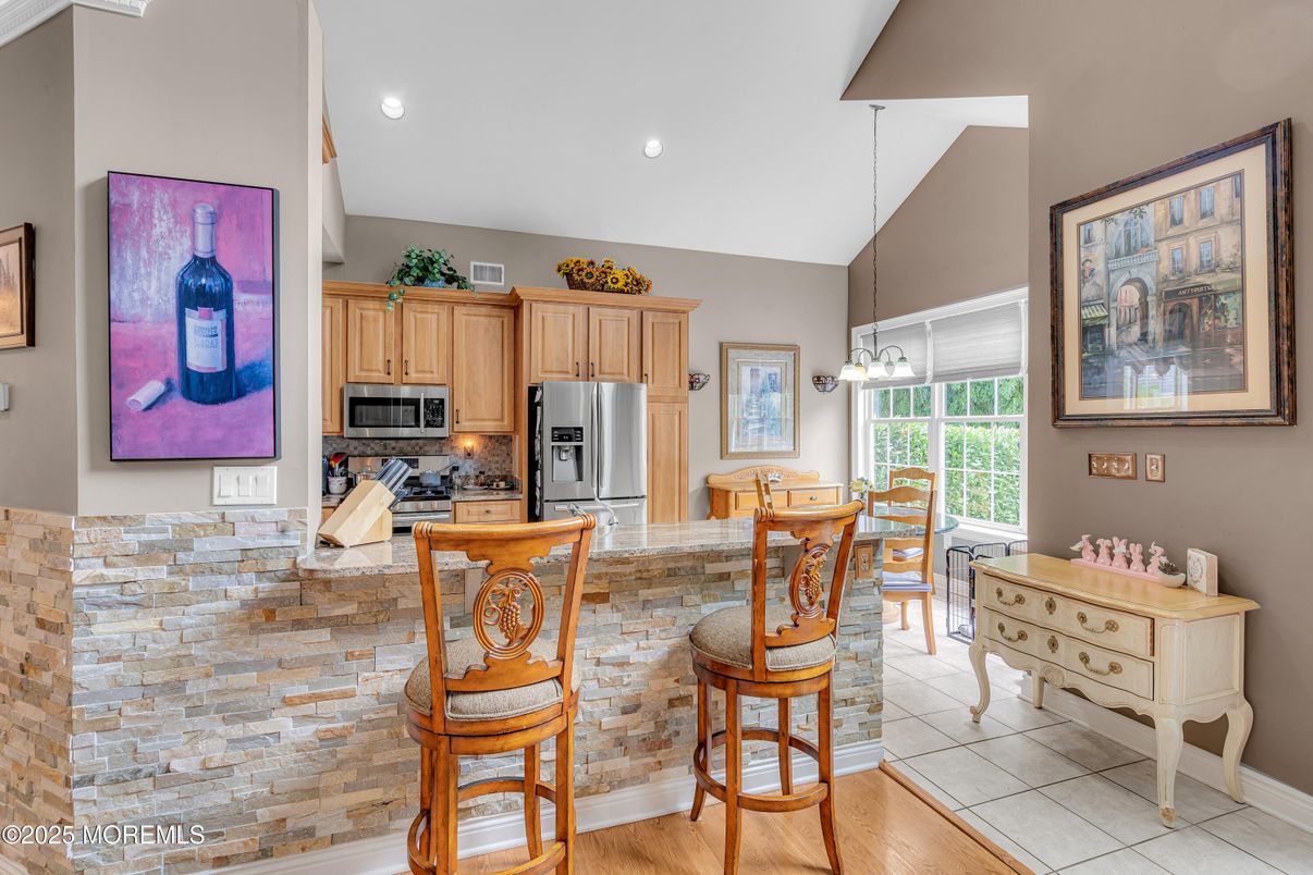 Dining room, Interior, Kitchen, Pendant Lights, Recessed Lighting, Stainless Steel Appliances, Wood Texture Flooring