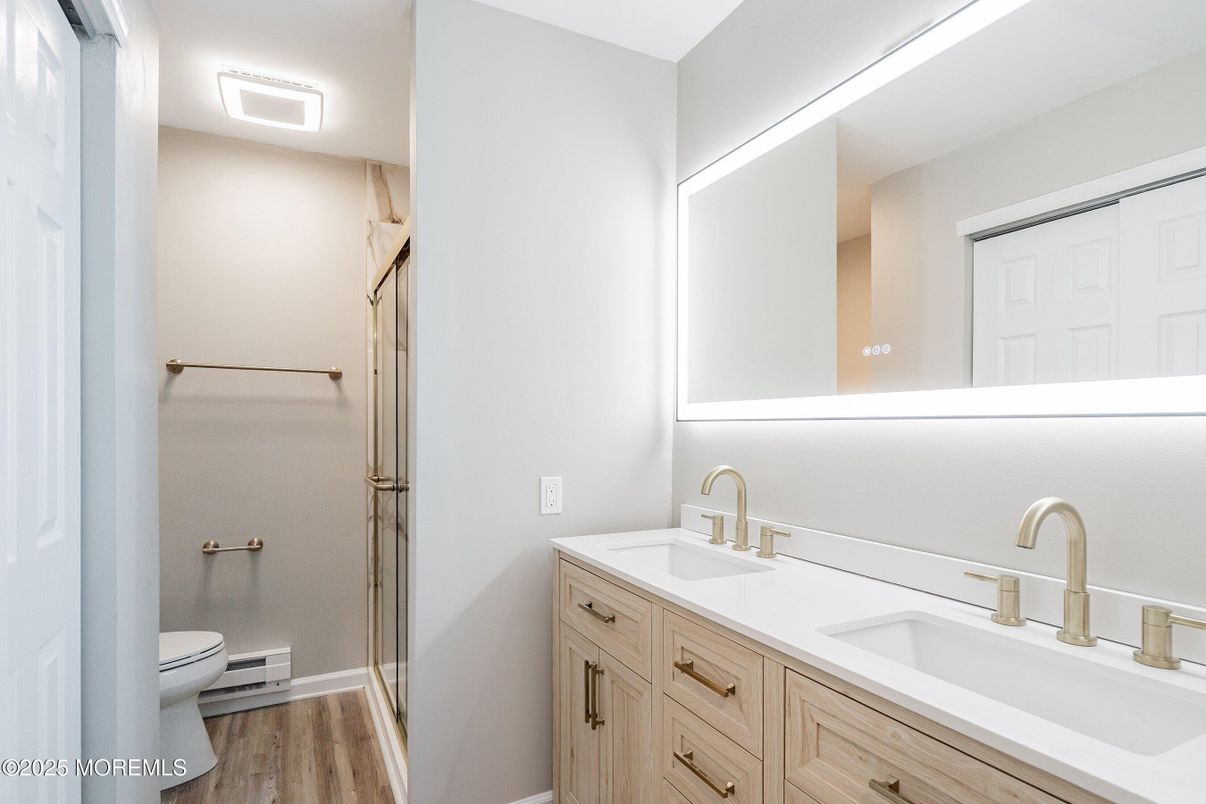 Bathroom, Dual Sink Vanities, Glass Shower, Interior, Wood Texture Flooring