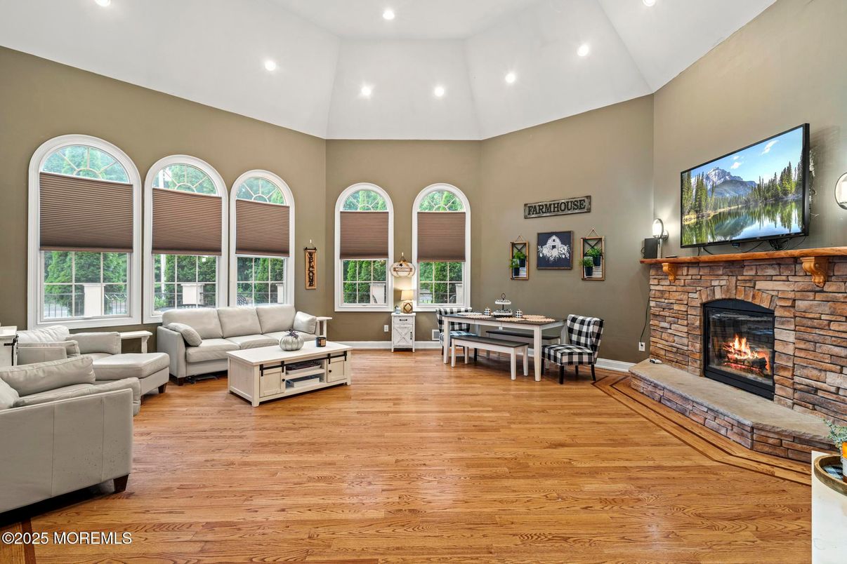 Dining room, Fireplace, Interior, Living room, Recessed Lighting, Wood Texture Flooring