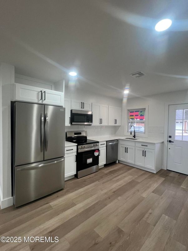 Interior, Kitchen, Recessed Lighting, Stainless Steel Appliances, Wood Texture Flooring