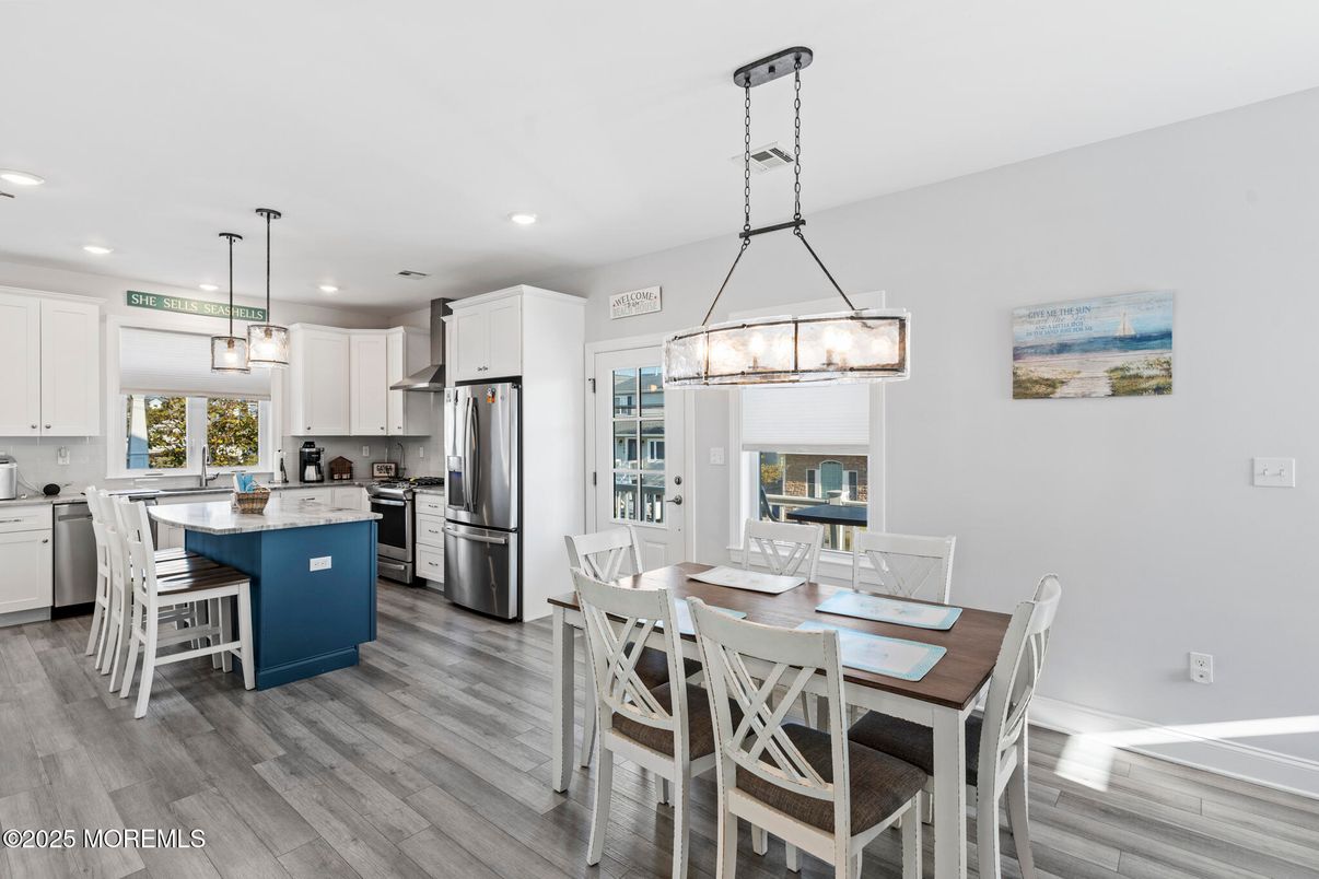 Dining room, Interior, Kitchen, Pendant Lights, Recessed Lighting, Stainless Steel Appliances, Wood Texture Flooring