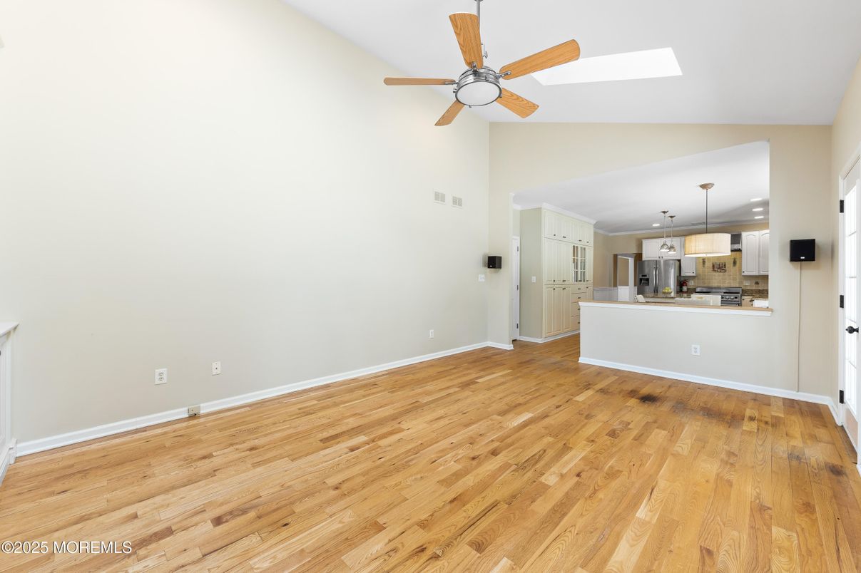 Empty room, Interior, Kitchen, Pendant Lights, Stainless Steel Appliances, Wood Texture Flooring
