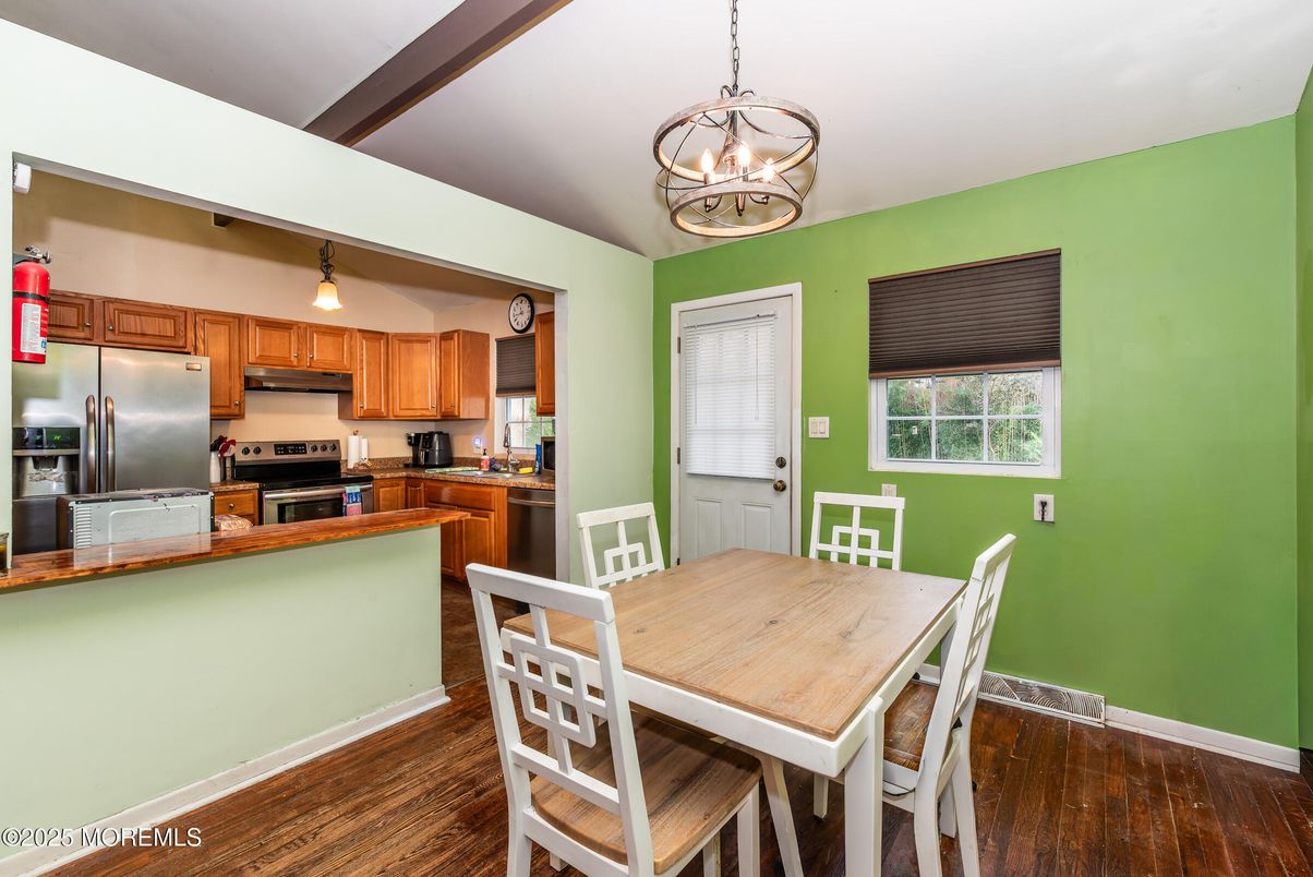 Chandelier, Dining room, Interior, Kitchen, Pendant Lights, Stainless Steel Appliances, Wood Texture Flooring