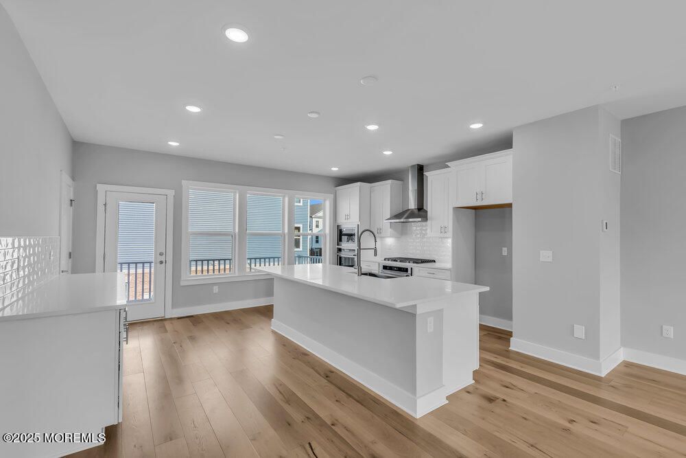 Interior, Kitchen, Recessed Lighting, Stainless Steel Appliances, Water, Wood Texture Flooring