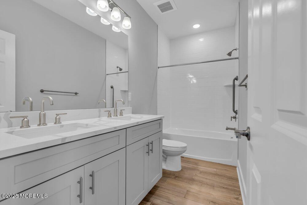 Bathroom, Dual Sink Vanities, Interior, Recessed Lighting, Wood Texture Flooring