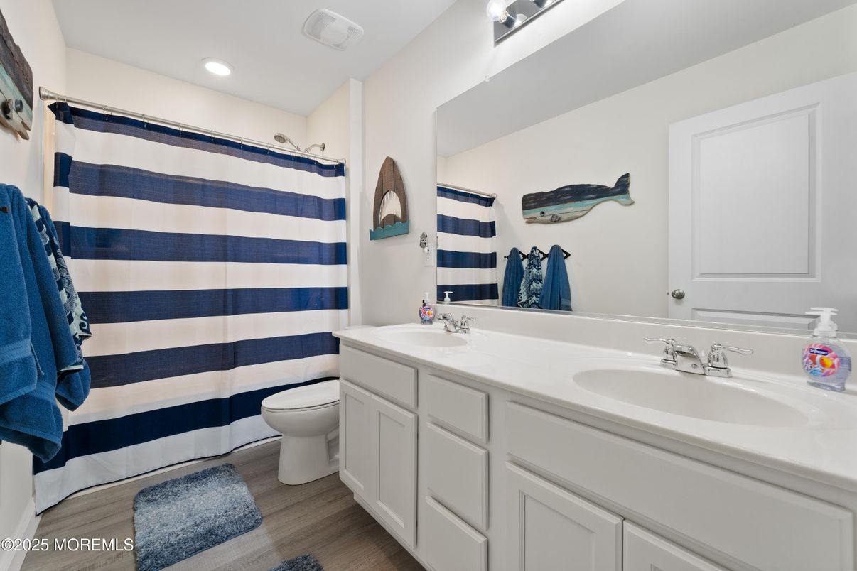 Bathroom, Dual Sink Vanities, Interior, Recessed Lighting, Wood Texture Flooring