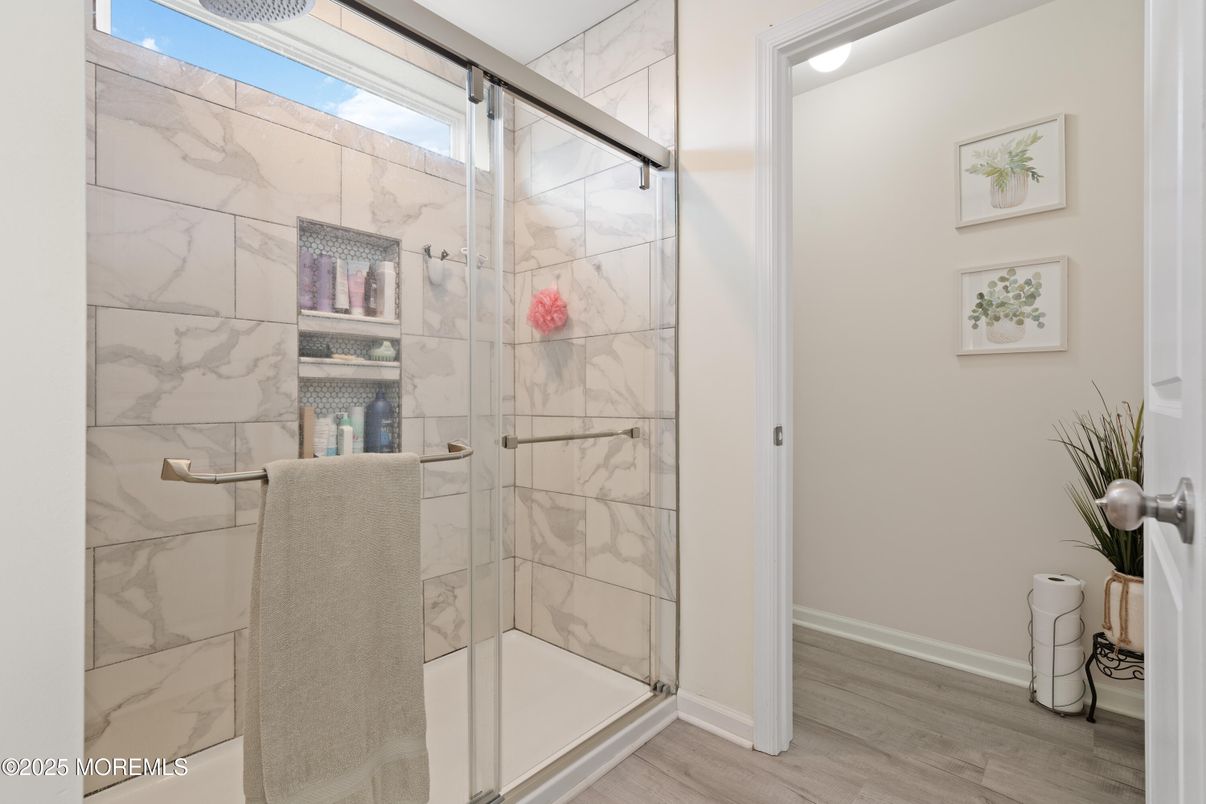 Bathroom, Glass Shower, Interior, Marble Walls, Wood Texture Flooring