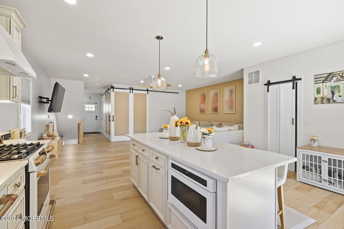 Interior, Kitchen, Pendant Lights, Recessed Lighting, Stainless Steel Appliances, Wood Texture Flooring
