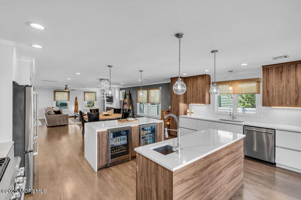 Dining room, Fireplace, Interior, Kitchen, Living room, Pendant Lights, Recessed Lighting, Stainless Steel Appliances, Wood Texture Flooring