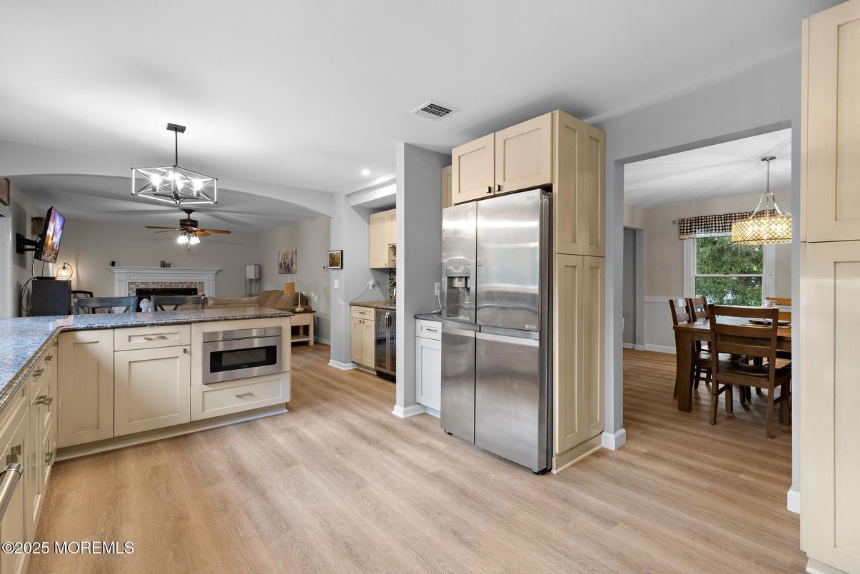 Dining room, Interior, Kitchen, Pendant Lights, Recessed Lighting, Stainless Steel Appliances, Wood Texture Flooring