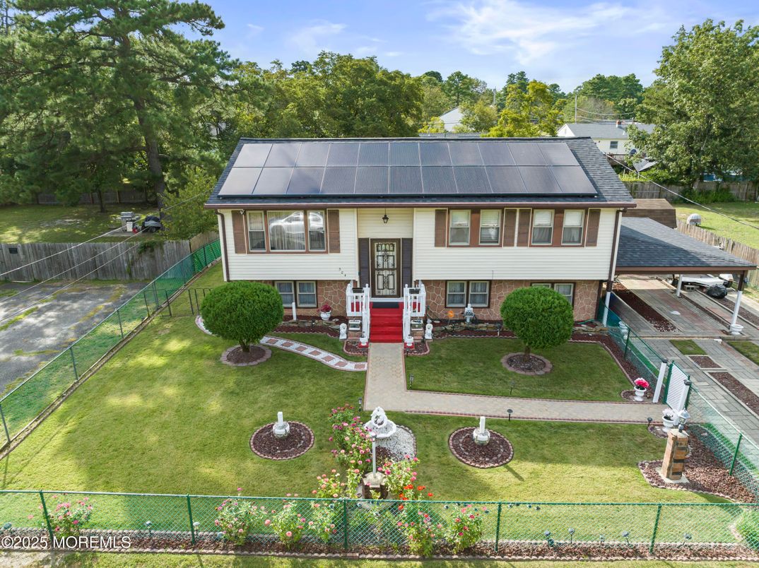 Exterior, Facade, Solar Panels, Raised Ranch