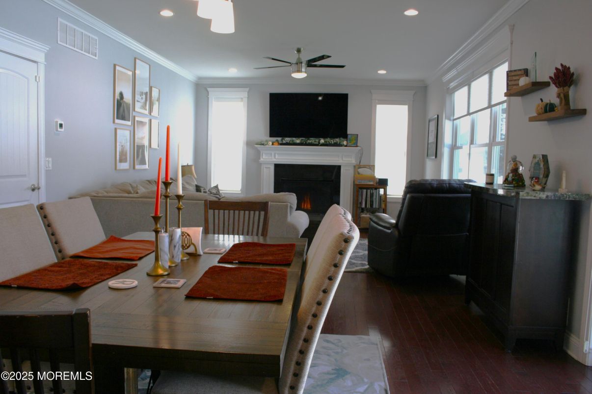 Dining room, Fireplace, Interior, Living room, Recessed Lighting, Wood Texture Flooring