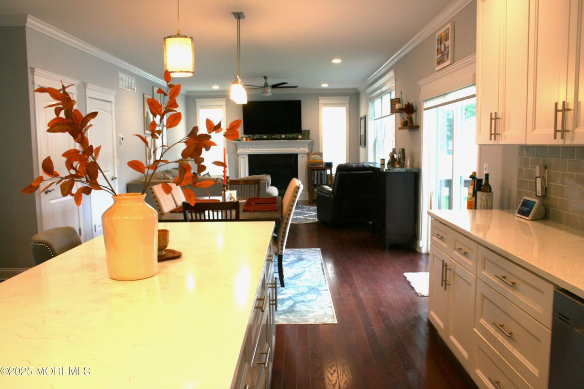 Dining room, Fireplace, Interior, Kitchen, Living room, Pendant Lights, Recessed Lighting, Wood Texture Flooring