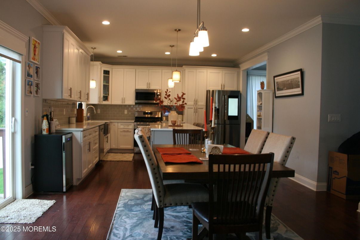 Dining room, Interior, Kitchen, Pendant Lights, Recessed Lighting, Stainless Steel Appliances, Wood Texture Flooring