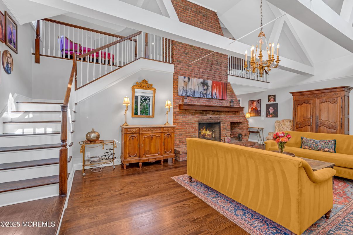 Chandelier, Fireplace, Interior, Living room, Stone Walls, Wood Texture Flooring