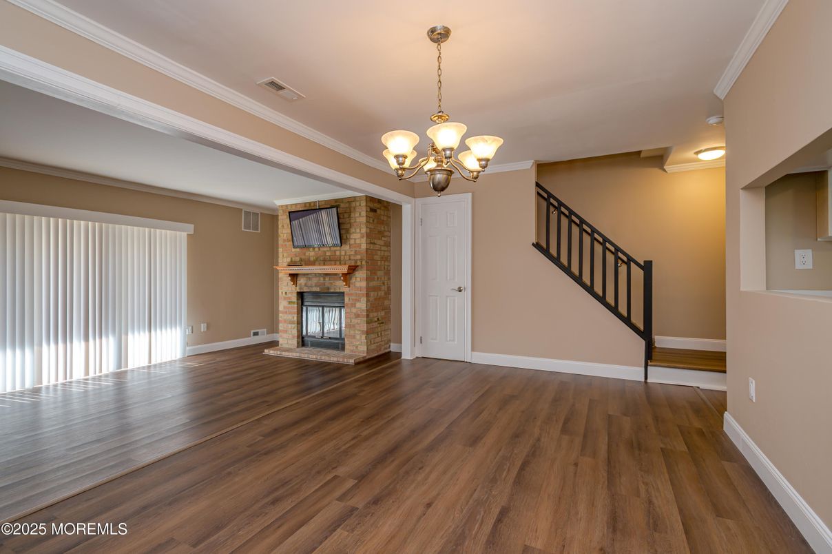 Chandelier, Empty room, Fireplace, Interior, Stone Walls, Wood Texture Flooring