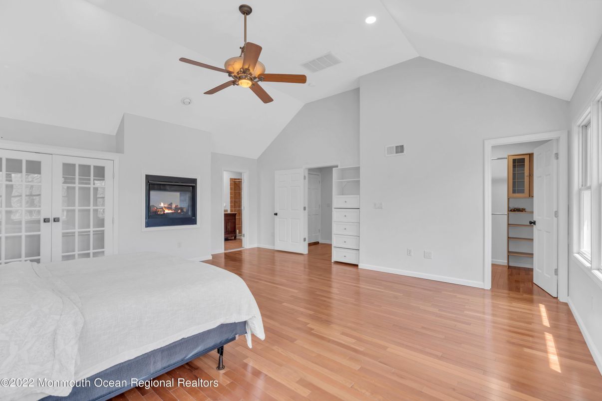 Bedroom, Fireplace, Interior, Recessed Lighting, Wood Texture Flooring