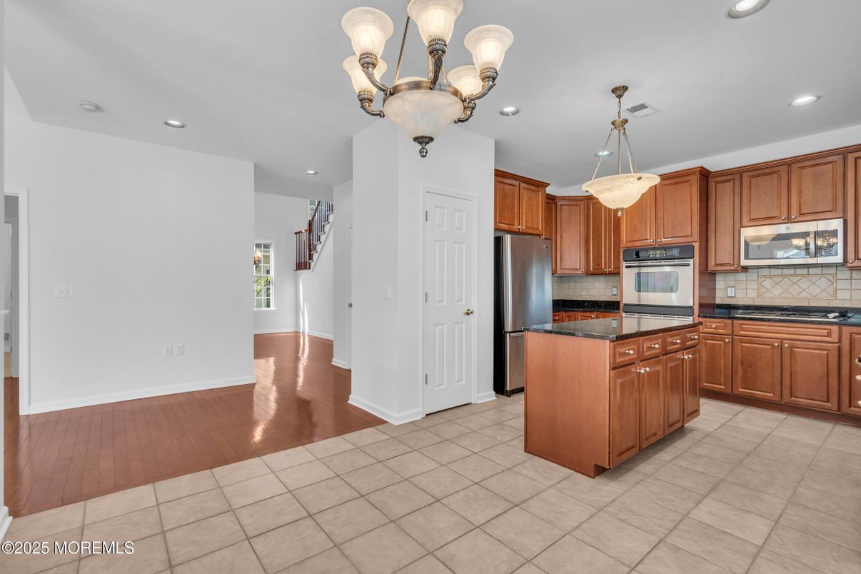 Chandelier, Interior, Kitchen, Pendant Lights, Recessed Lighting, Stainless Steel Appliances, Wood Texture Flooring