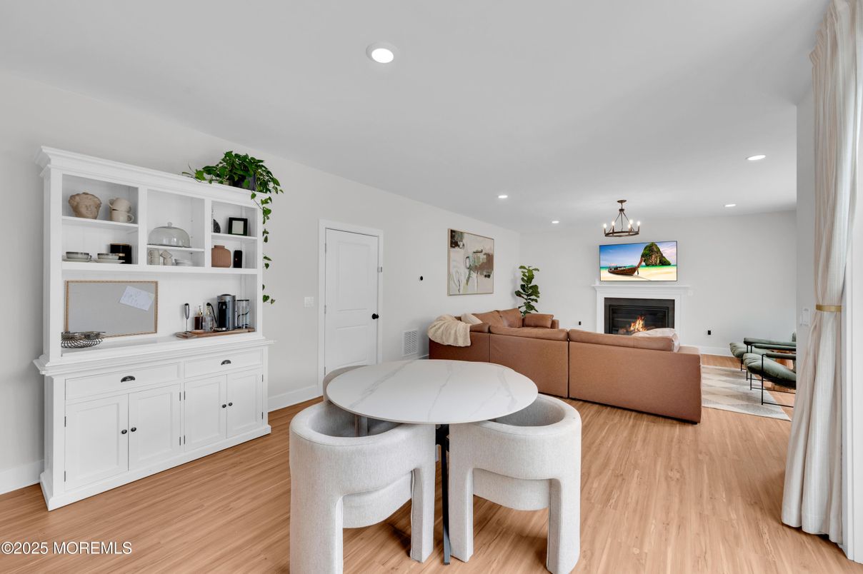 Dining room, Fireplace, Interior, Living room, Recessed Lighting, Wood Texture Flooring