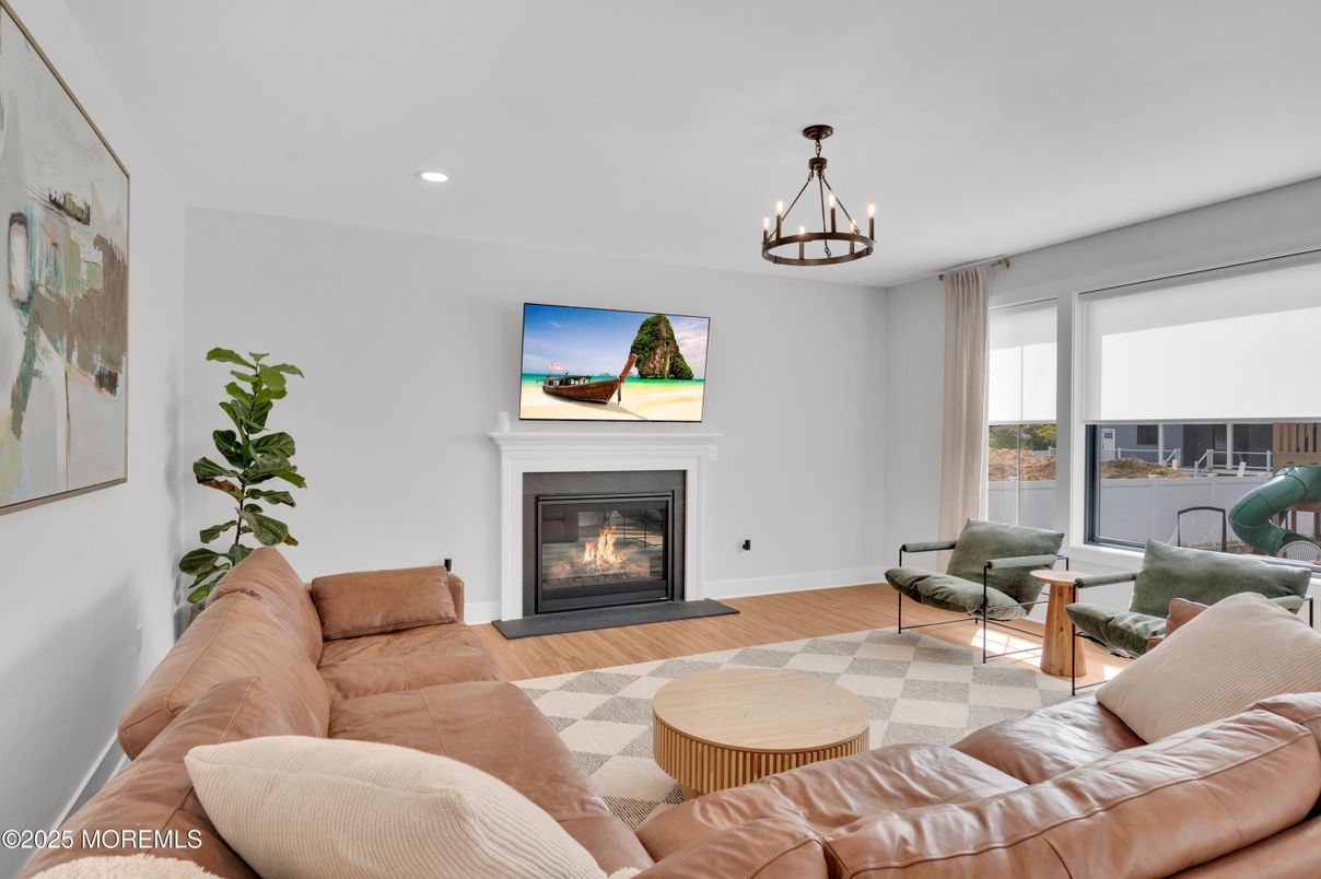 Chandelier, Fireplace, Interior, Living room, Recessed Lighting, Wood Texture Flooring