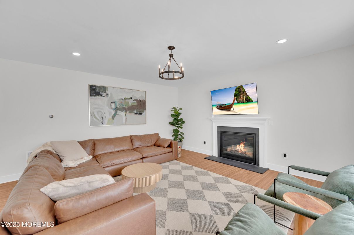 Chandelier, Fireplace, Interior, Living room, Recessed Lighting, Wood Texture Flooring