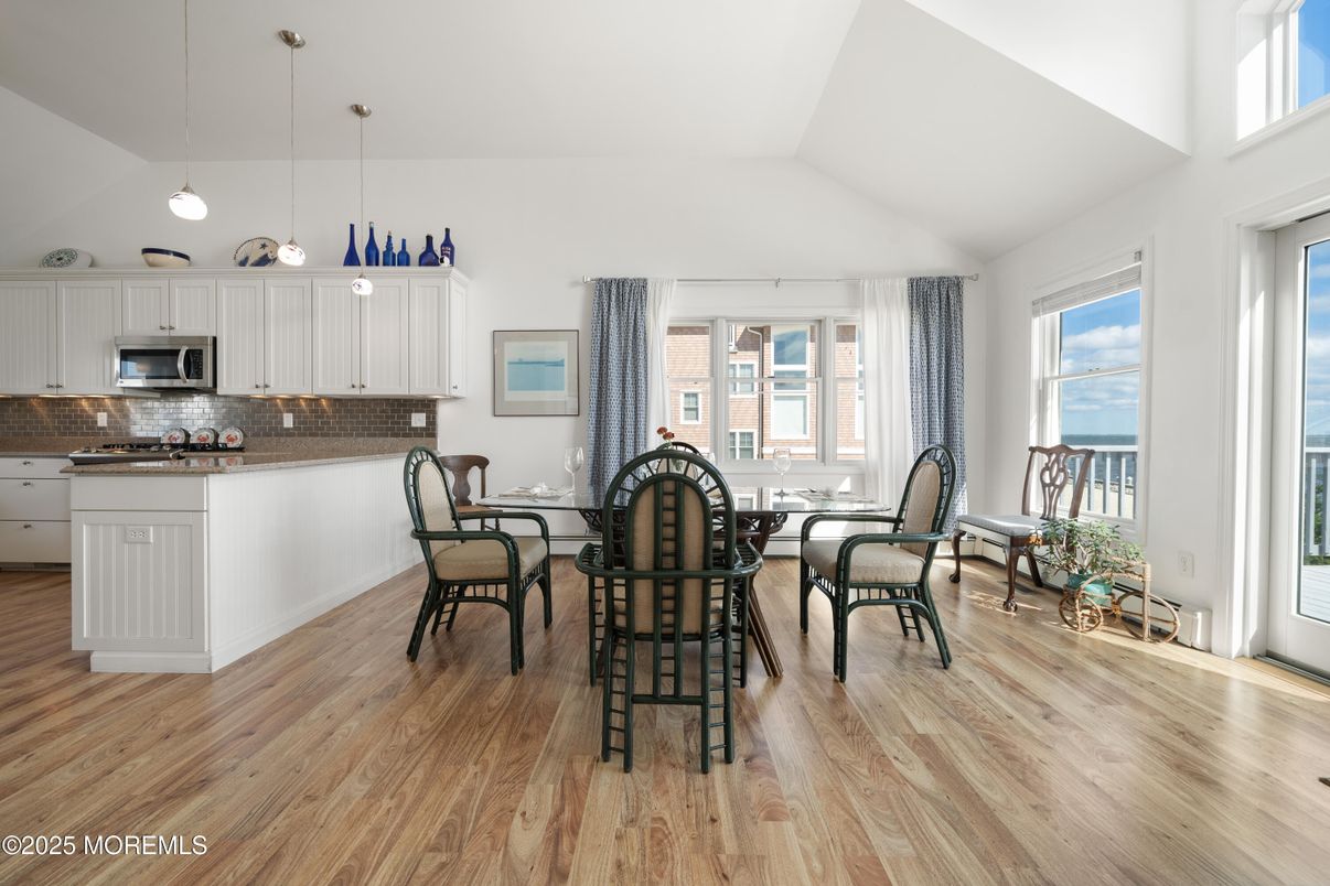 Dining room, Interior, Kitchen, Pendant Lights, Stainless Steel Appliances, Water, Wood Texture Flooring